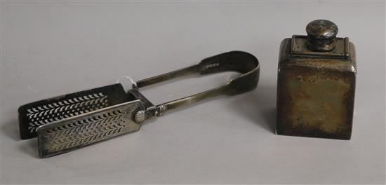 A pair of George IV silver fiddle pattern asparagus tongs and a late Victorian silver travelling canister.